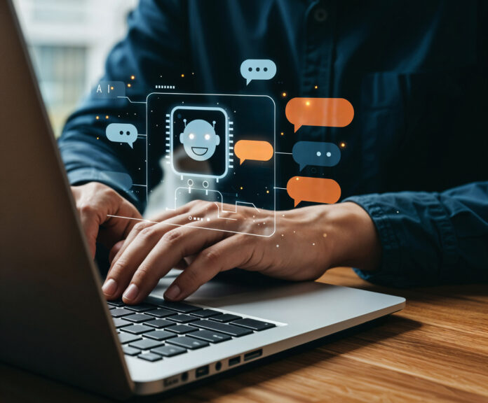 man-using-laptop-with-chatbot-interface La IA redefine la seguridad laboral pasando de los chatbots a las cadenas de montaje